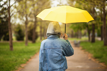 person with yellow umbrella