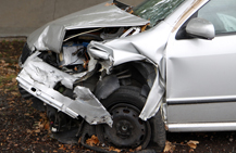 silver car with bumper damage