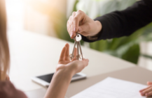 landlord giving keys to tenant 
